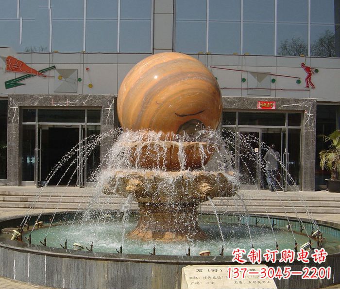 周口石来运转球晚霞红风水球石雕